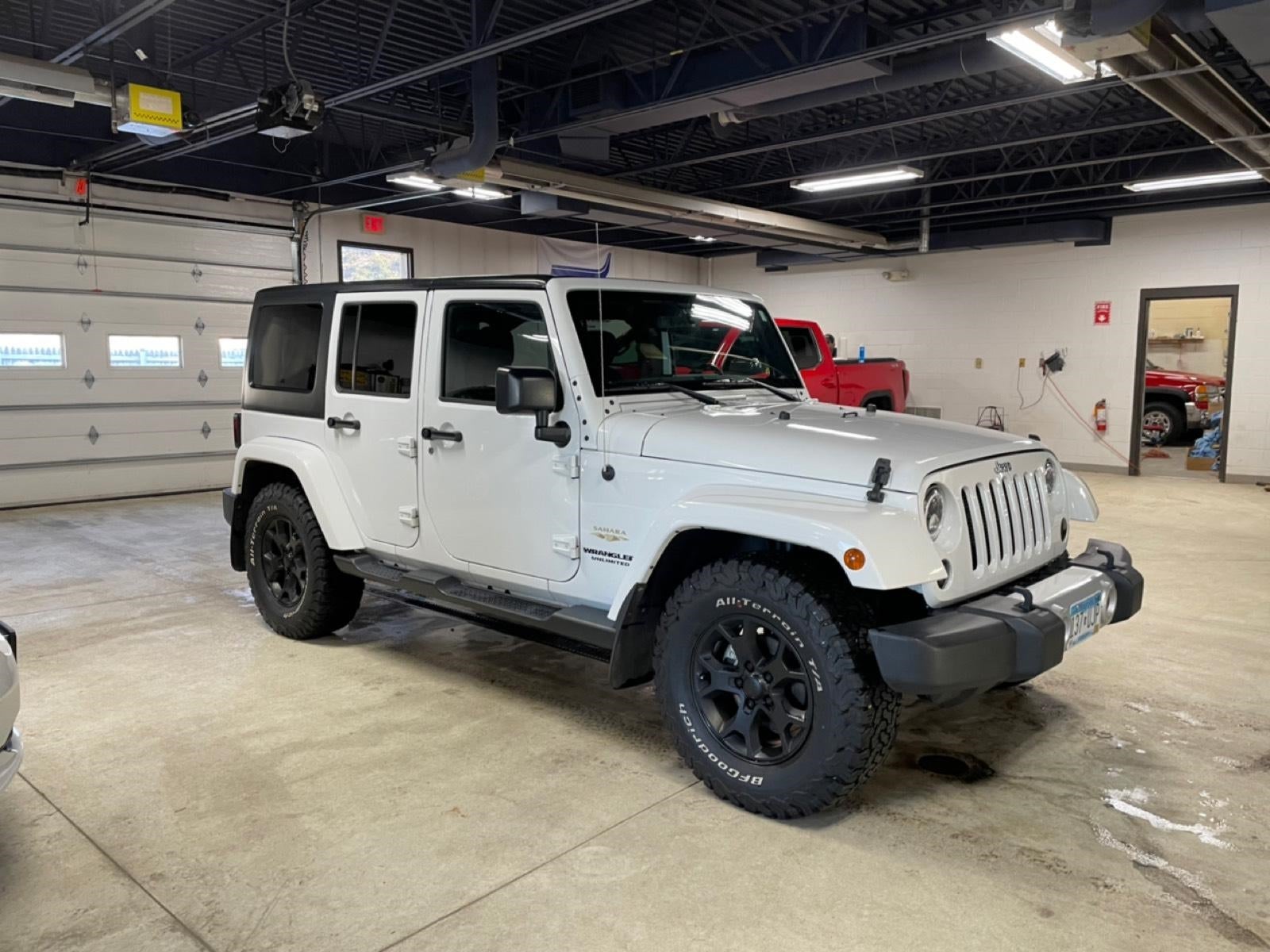 Used 2015 Jeep Wrangler Unlimited Sahara with VIN 1C4BJWEGXFL617928 for sale in New Ulm, Minnesota